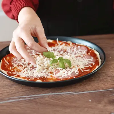 Produktbild von Pizzablech Ø 20 cm, 10-teilig, rund, Blaublech,  Germany