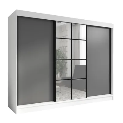 A modern wardrobe with sliding doors and mirrored panels.