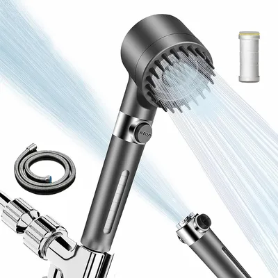 A shower head with water spraying from it, along with a hose and a filter cartridge.