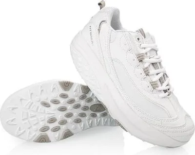 A pair of white athletic shoes shown from a diagonal angle on a white background.