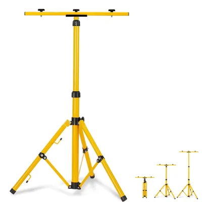 A yellow tripod stand for lights against a white background.