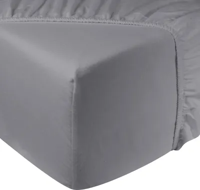 A close-up view of the corner of a gray fitted sheet.