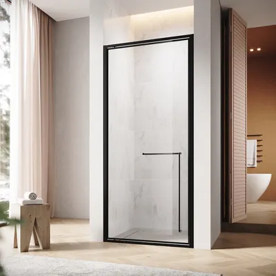 A modern bathroom with a black-framed glass shower door.