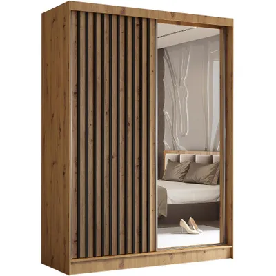 A wardrobe with sliding doors, one of which is mirrored, reflecting a bedroom scene.