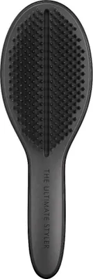 A black hairbrush is shown from a top-down perspective against a white background.