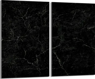 A close-up of two black marble panels with white veining.