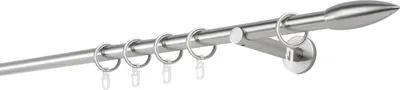 A close-up view of a silver curtain rod with rings and a wall mount.
