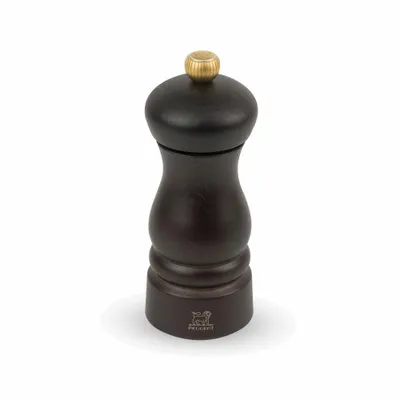 A single dark brown pepper mill with a gold knob on top, set against a white background.