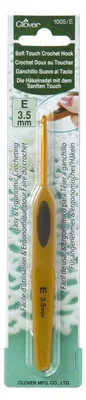 A crochet hook is displayed in its packaging.
