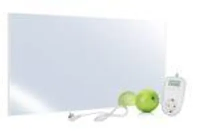 A white infrared heating panel with a mirror surface is shown on a white background, with a power cord, a thermostat, and two green apples.
