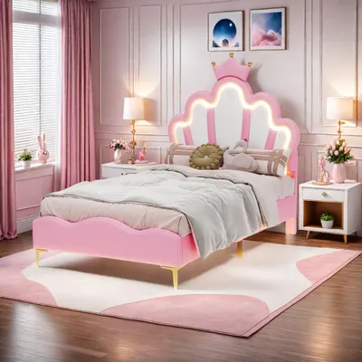 A child's bedroom with a pink bed and crown-shaped headboard.