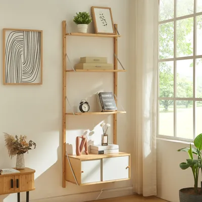 A wooden ladder shelf with storage drawers, decorated with books, a clock, and vases, placed against a wall next to a window.