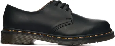 A studio shot of a single black shoe.