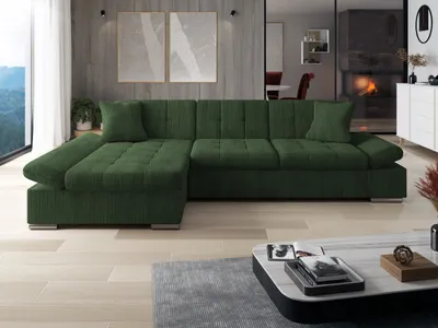 A modern living room with a green sectional sofa, coffee table, and fireplace.
