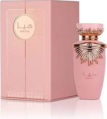 A pink perfume bottle and its matching box are displayed against a white background.