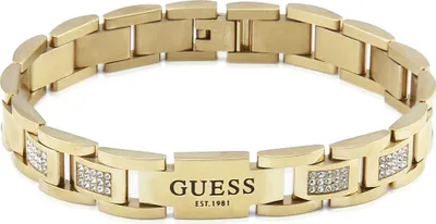 A close-up studio shot of a gold-colored Guess bracelet with crystal accents.