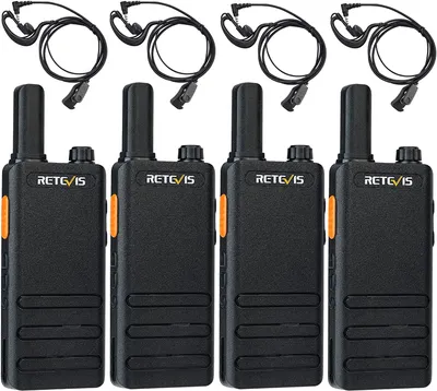 Four black walkie-talkies with orange accents and attached earpieces are arranged in two rows on a white background.