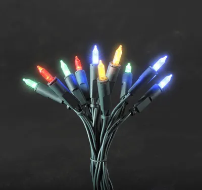 A bunch of colorful LED mini lights tied together against a black background.
