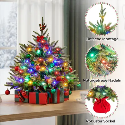 A decorated mini Christmas tree with gifts underneath, set against a window with a snowy view.
