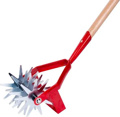A garden tool with a wooden handle and a metal rotating head with sharp blades.