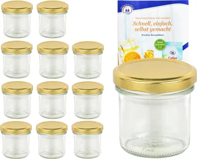 A set of glass jars with golden lids and a recipe booklet.