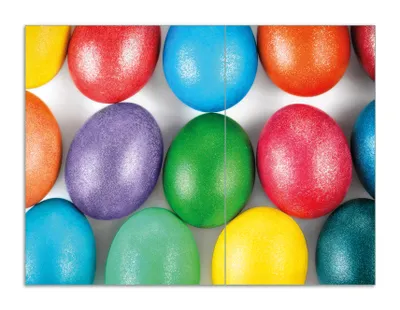 Produktbild von Wallario Herdabdeckplatte aus Glas, Größe 70 x 52 cm 2-teilig, Motiv Bunte Oster-Eier in Nahaufnahme mit kräftigen Farben