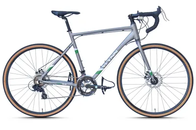 A studio shot of a gray WYNN gravel bike with tan tires, set against a white background.