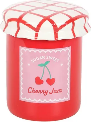 A ceramic jar shaped like a jar of cherry jam, with a lid decorated with a red and white checkered pattern.