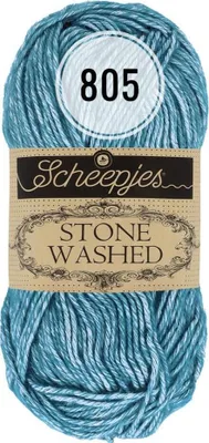 A ball of blue yarn with a label.