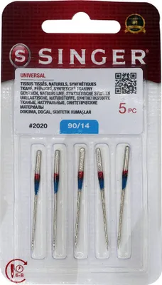 A retail package containing sewing machine needles.