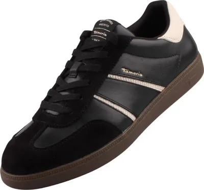 A single black low-top sneaker with cream accents and a brown sole, presented against a white background.