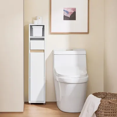 A bathroom scene with a toilet and a narrow storage cabinet.