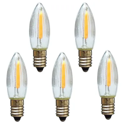 Five LED filament candle bulbs arranged in a scattered pattern on a white background.