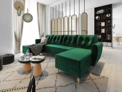 A modern living room with a green sectional sofa, coffee tables, and decorative screens.