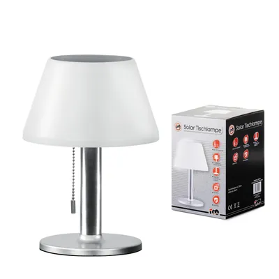 A solar table lamp and its packaging are shown against a white background.