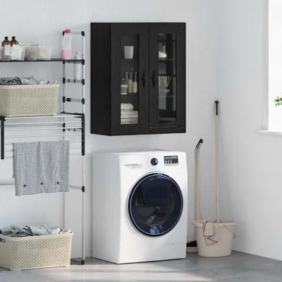 A laundry room scene with a washing machine, drying rack, and wall cabinet.