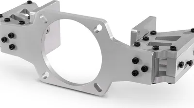 A close-up, studio shot of a silver metal bracket assembly against a white background.