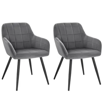Two dark gray velvet chairs with black metal legs are shown against a white background.
