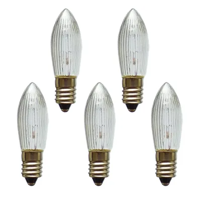 Five clear, ribbed candle-shaped light bulbs with gold bases are arranged in a scattered formation on a white background.