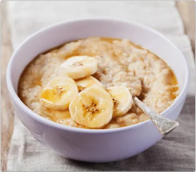 Produktbild von Spritzschutz Herdabdeckplatte Schneidebrett aus Glas Müsli mit Bananen 1-Teilig (60x52cm)