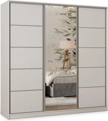 A white sliding door wardrobe with a mirrored center panel, reflecting a bedroom scene with a bed and a floor lamp.