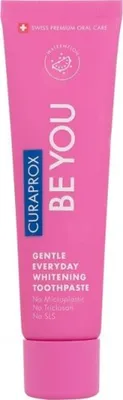 A pink tube of Curaprox toothpaste.