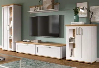 A living room setup featuring a TV, media console, and storage cabinets.