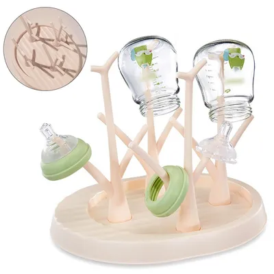Produktbild von Multifunktionaler Babyflaschenhalter ,4 große + 12 kleine Halter, abnehmbar,auslaufsicher, stabil & platzsparend für Flaschen, Sauger und Babyzubehör