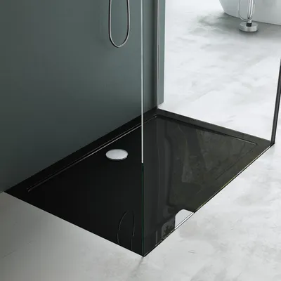 A black shower tray in a modern bathroom.