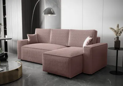 A pink sectional sofa in a modern living room setting.