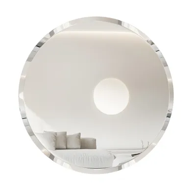 A round, frameless mirror reflecting a minimalist interior with a sofa and a circular light fixture.