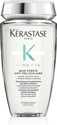 A clear, front-facing studio shot of a bottle of Kérastase Symbiose Bain Pureté Anti-Pelliculaire shampoo against a white background.