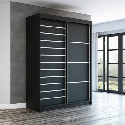 A modern black wardrobe with sliding doors is shown in a room with a concrete wall and wooden floor.