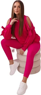 Immagine prodotto di Un completo composto da una felpa con fiocchi sulle maniche e leggings color fucsia